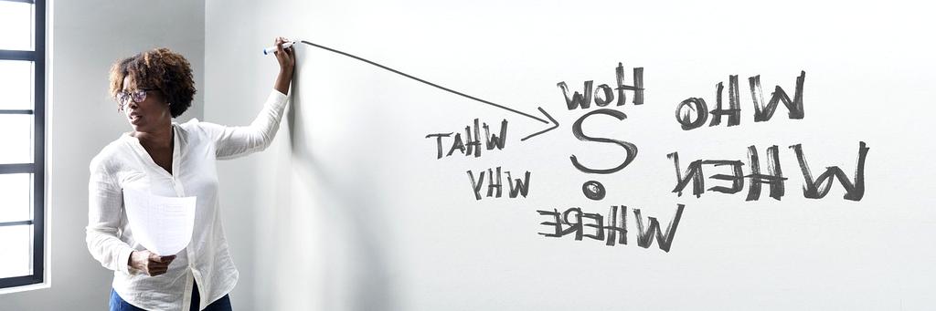 Person mapping out a learning path on a whiteboard